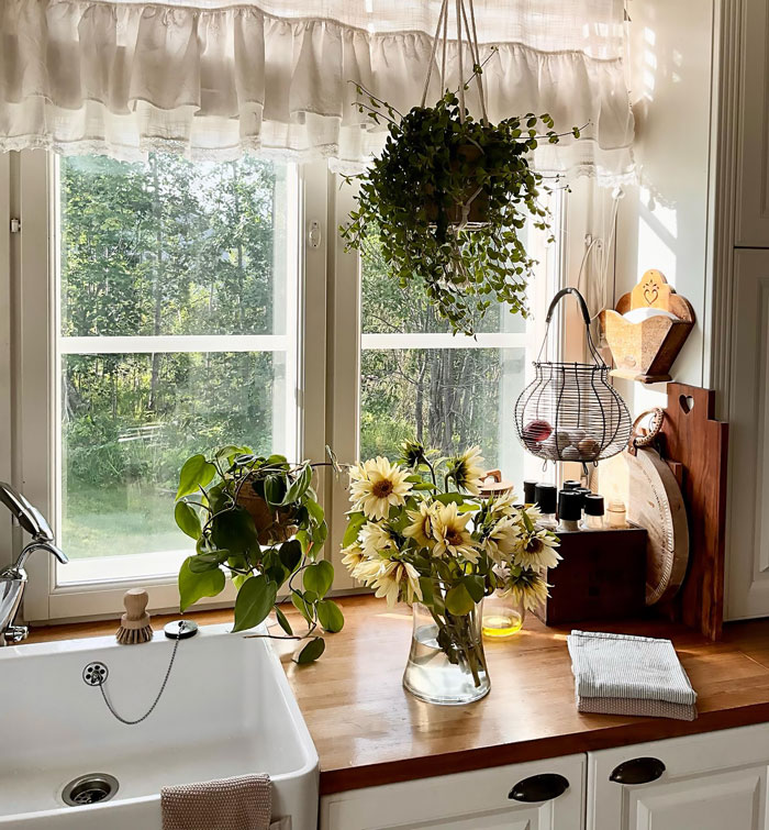 Farmhouse kitchen with flowers and sink