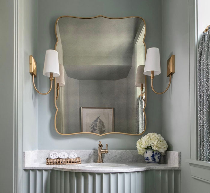 Creamy marble sink with irregular mirror