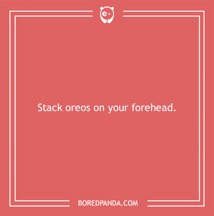 "Funny dare for stacking Oreos on forehead against a red background."