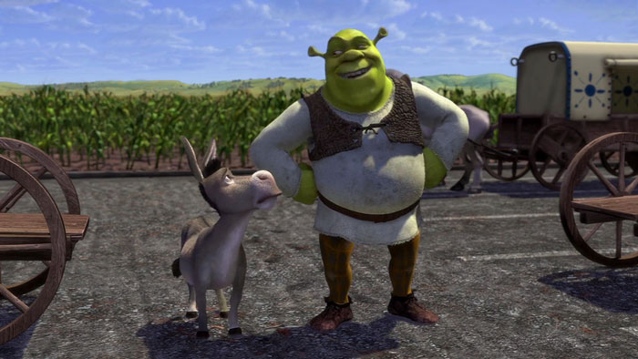 Shrek and donkey looking at a very large castle