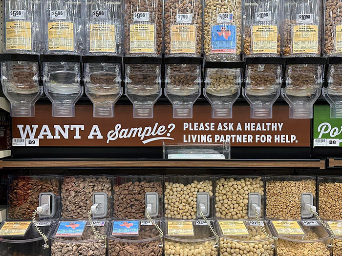 The Signage At The Grocery Store For Samples