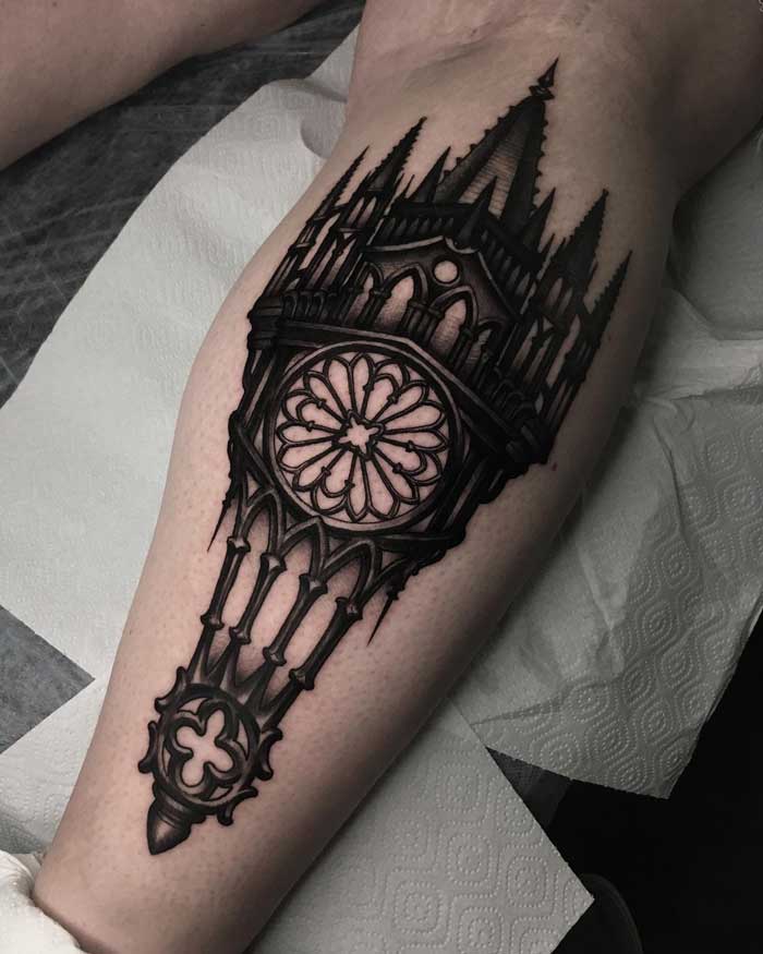 Gothic tattoo featuring intricate cathedral architecture design on a person's leg.