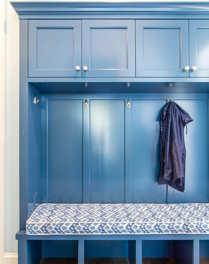 A blue hall tree with a bench and seat padding placed on it A blue hall tree with a bench and seat padding placed on it