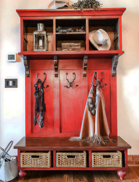 A red-painted wooden antique hall tree with many items on it