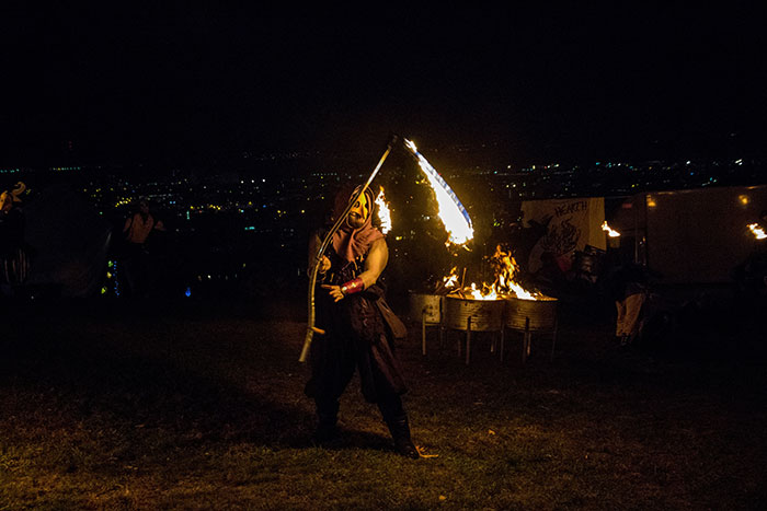 Man wearing Celtic costume dancing with fire