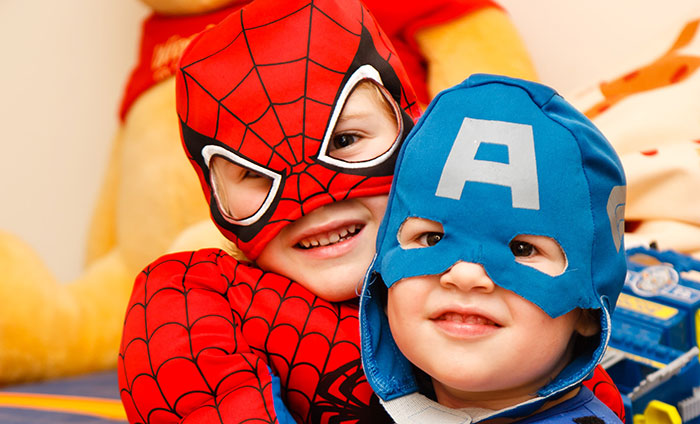 Kids wearing Spiderman and Captain America costumes
