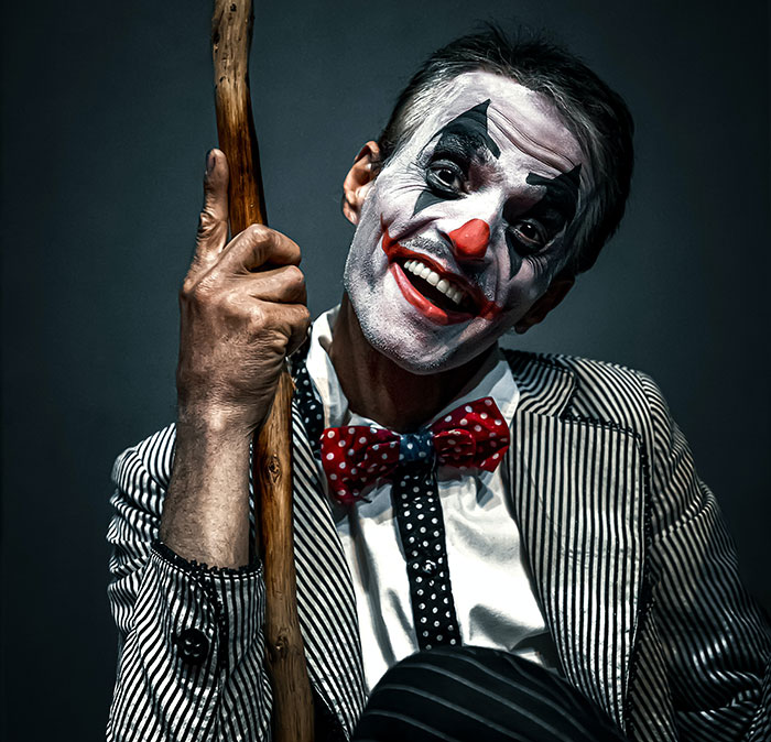 Man wearing clown costume