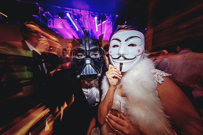 People wearing masks at the party