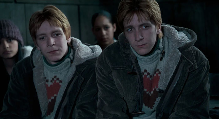 Fred and George Weasley listening