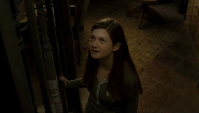 Ginny Weasley looking up and talking