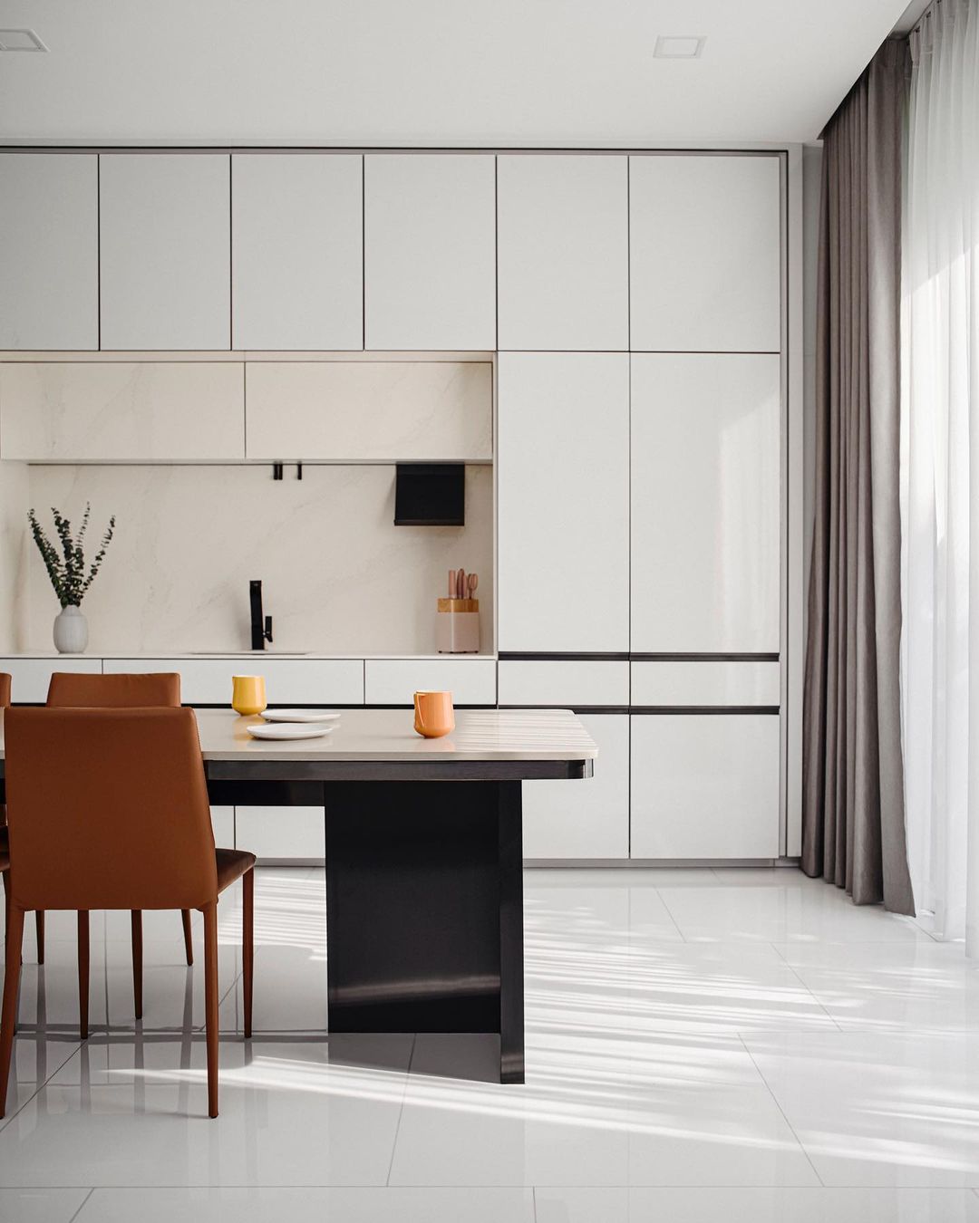 Modern big kitchen with a dining table and orange chairs showcasing living room ideas and interior design insights. Modern big kitchen with a dining table and orange chairs showcasing living room ideas and interior design insights.