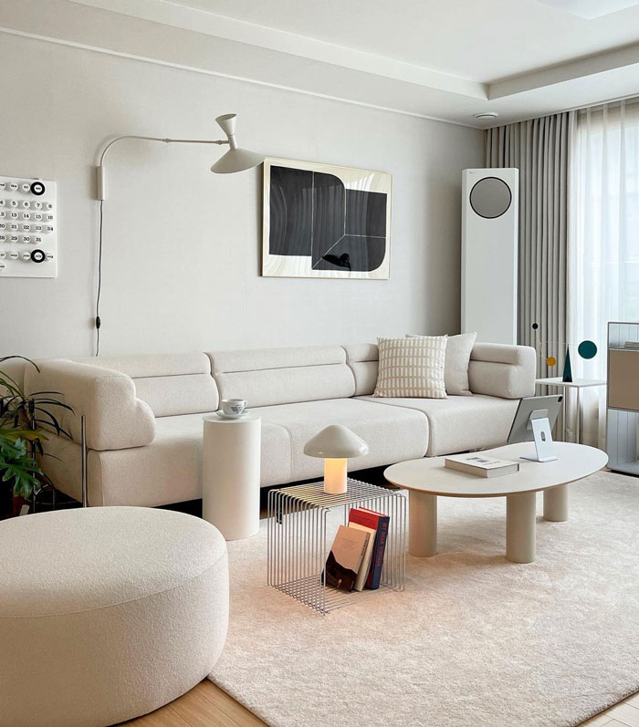 Neutral colored living room with big white couch