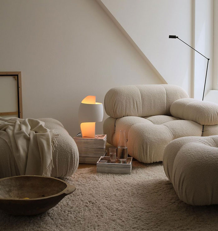 Cozy living space with white armchairs