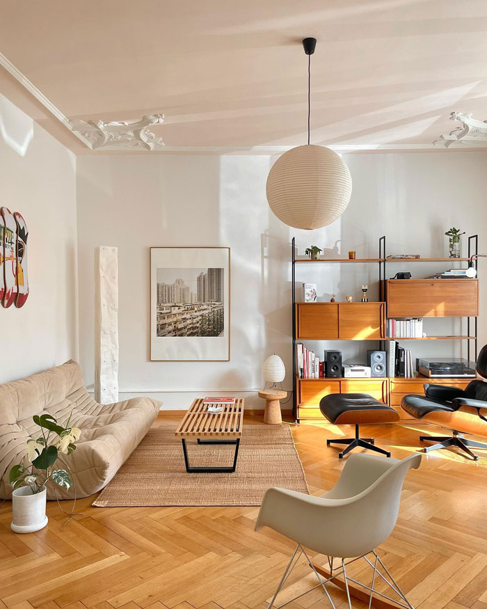 Living room ideas featuring a beige couch, modern shelving, wooden accents, and natural light in a stylish living space. Living room ideas featuring a beige couch, modern shelving, wooden accents, and natural light in a stylish living space.