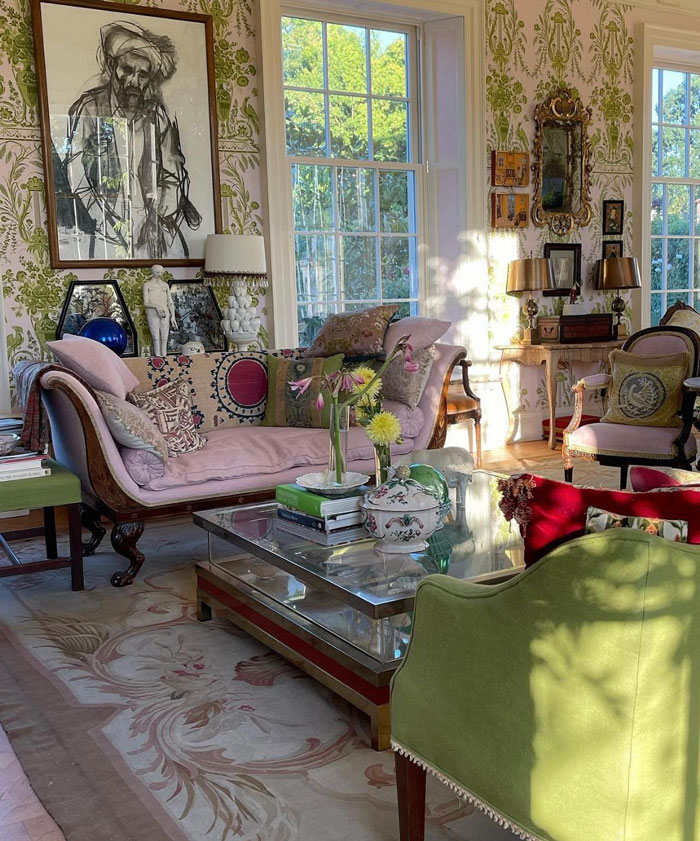 Colorful living room ideas featuring a vintage style couch, patterned wallpaper, and bright natural light. Colorful living room ideas featuring a vintage style couch, patterned wallpaper, and bright natural light.