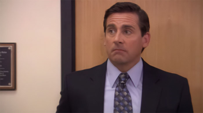 Michael Scott with his eyebrowes raised