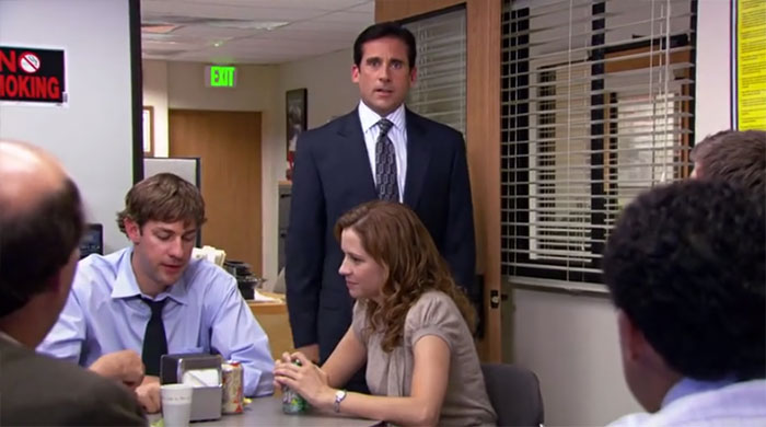 Michael Scott standing in the conference room
