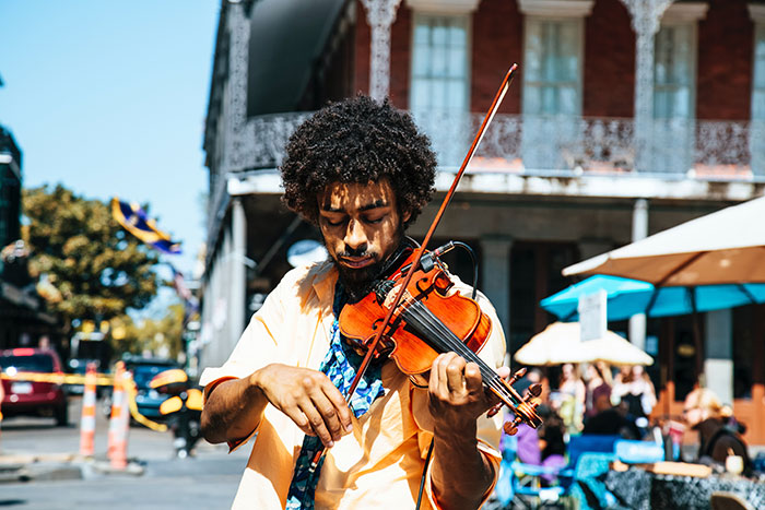 Man playing with violin in the outside