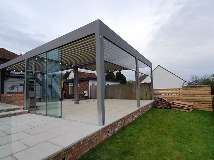 modern pergola with glass walls and metal frame