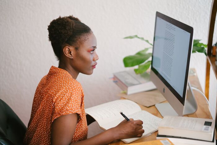 Woman Looking AT The Screen And Reading 