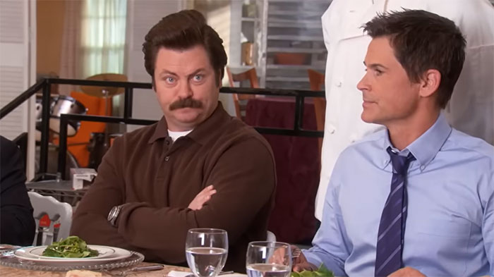 Ron Swanson and sitting in a restaurant