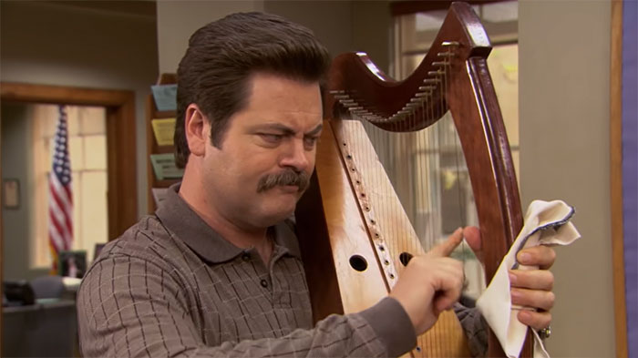 Ron Swanson playing a harp
