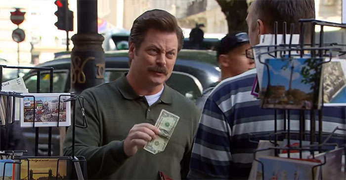Ron Swanson gives the dollar to the street postcards seller