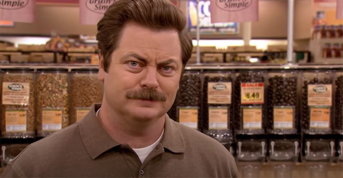 Ron Swanson standing in a vegan grocery store