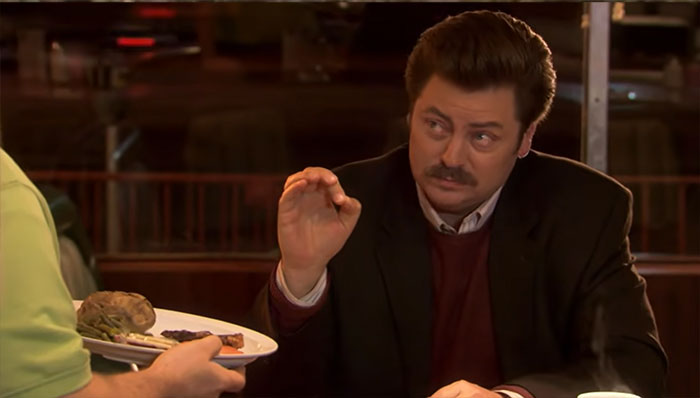 Ron Swanson talking with a waiter