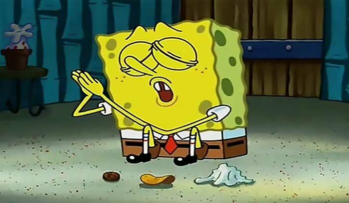 Spongebob singing with a penny, chip and a napkin in front of him