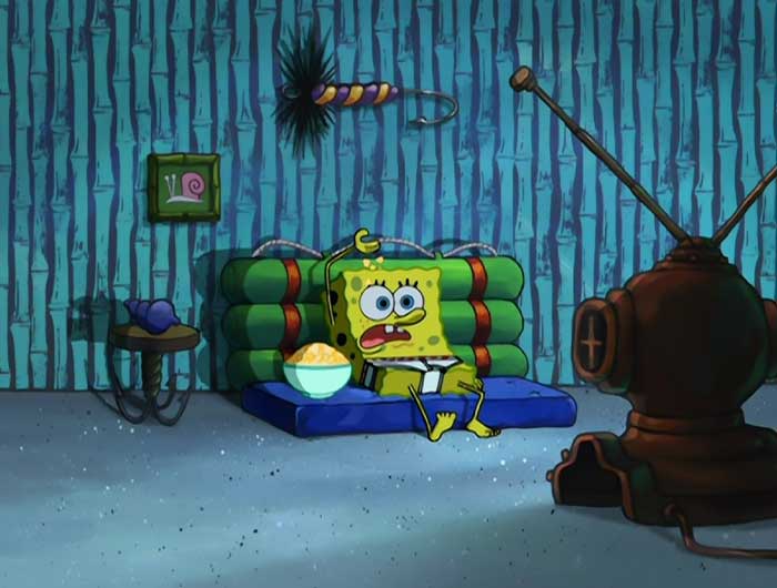 Spongebob sitting on the couch with no pants