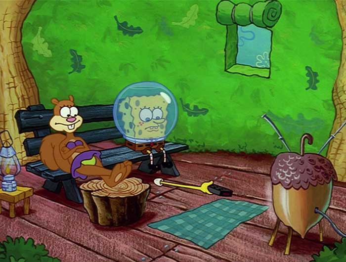 Sandy and Spongebob sitting on a bench watching tv