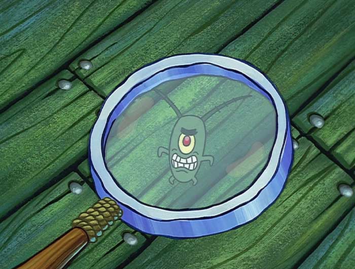 Plankton looking up through a magnifying glass angrily