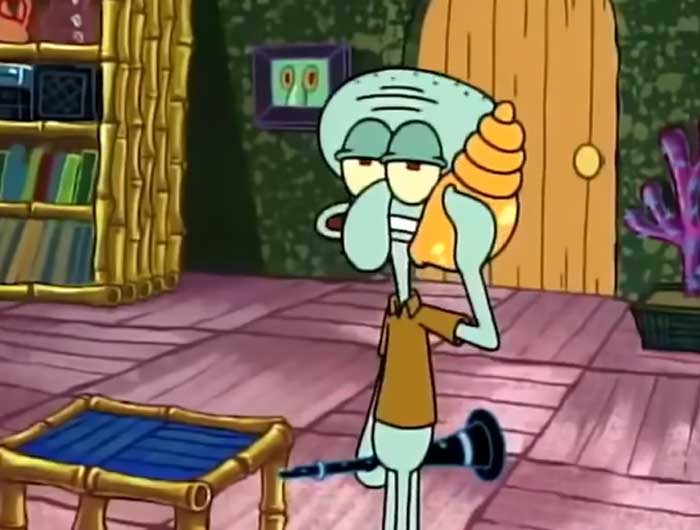 Squidward looking disinterested while answering a call