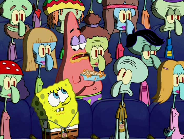 Patrick holding up nachos while surrounded by squidwards and spongebob