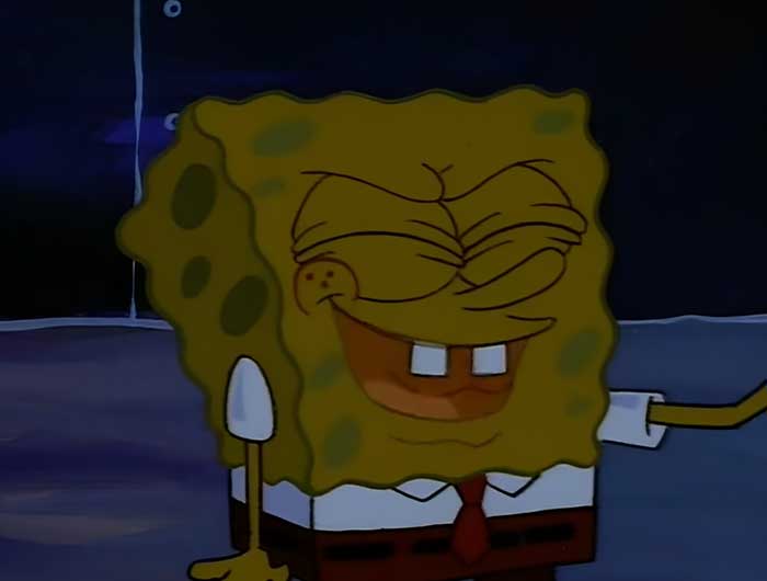Spongebob looking happy in the dark