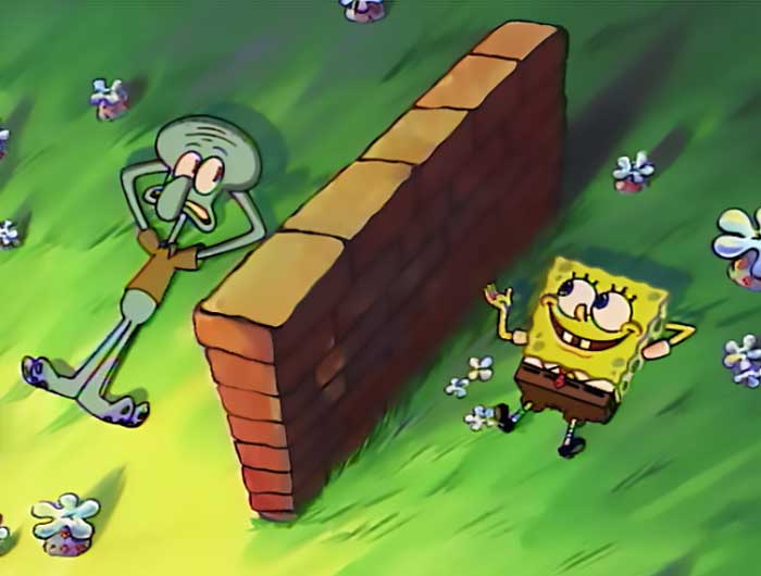 Squidward and spongebob laying down on grass being separated by a small wall