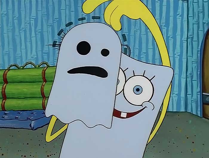 Spongebob making his hand into a ghost while dressed up as a ghost