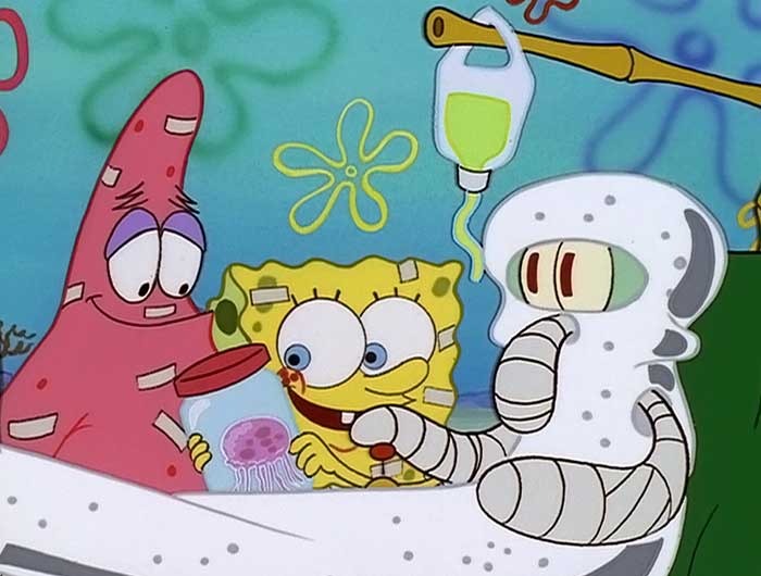 Spongebob showing squidward a jellyfish while squidward is fully wrapped up