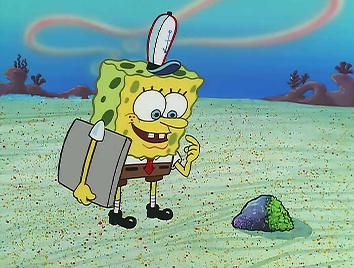 Spongebob Looking a t a rock with moss