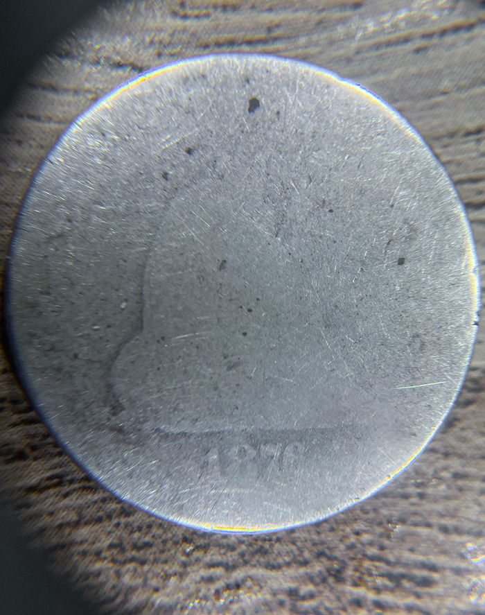 This Quarter From 1876 Is Worn Almost Completely Flat