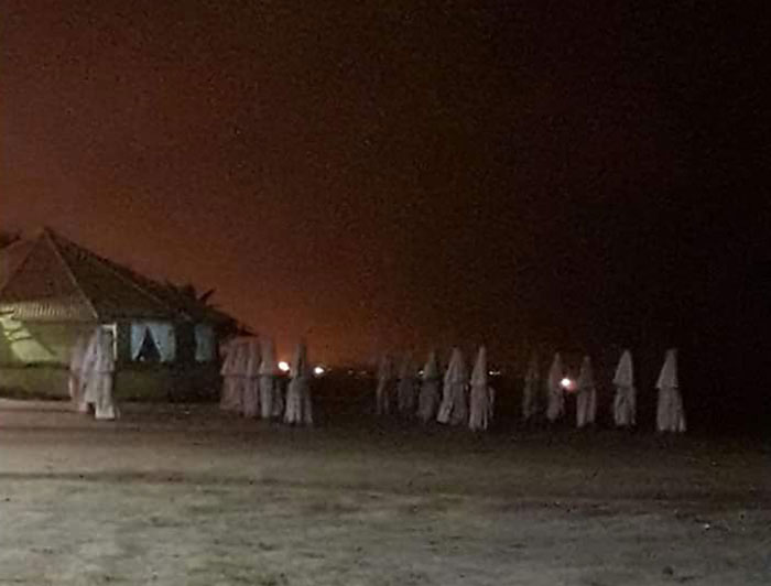 You Get Afraid Thinking These Are Ku Klux Klan Members Until You Realize They Are Only Closed Parasols In The Beach