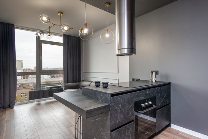 gray soapstone kitchen island in a contemporary minimalist style apartment 