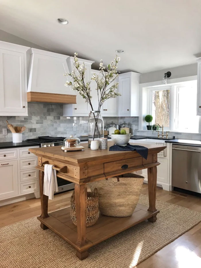 a kitchen with a vintage wooden kitchen island 