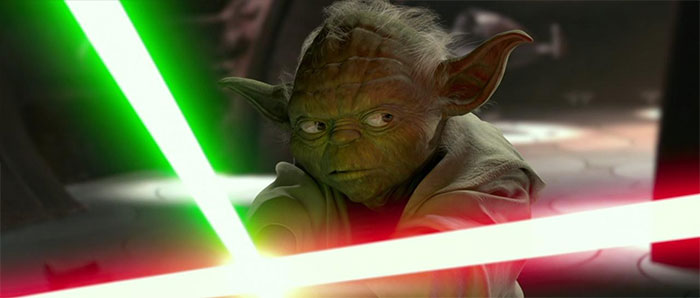 Yoda holding lightsaber chopstick