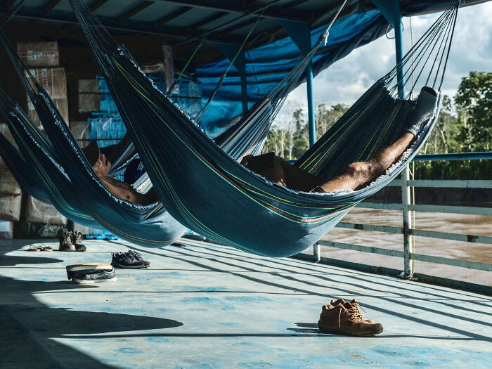 Passengers rest in hammocks on the Eduardo 7