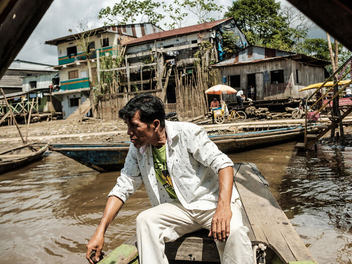 The Belén district is a floating community on the Amazon River characterized by its stilted houses, bustling markets, and vibrant street life, Iquitos