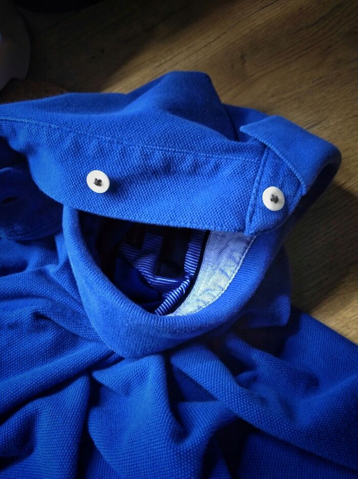 An image of a polo shirt that looks like it's smiling