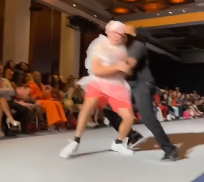 Fashion Week Impostor Goes Viral As He Catwalks Wearing A Trash Bag And No One Notices