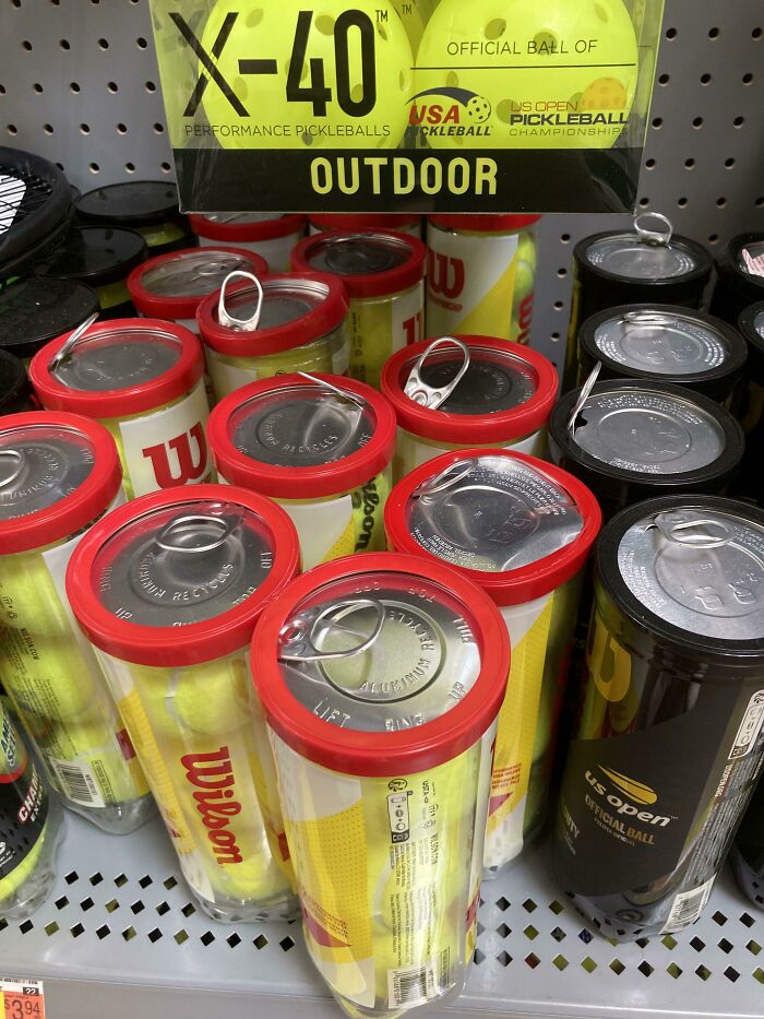 Someone Popped The Tops Of All These Tennis Ball Canisters At My Local Walmart